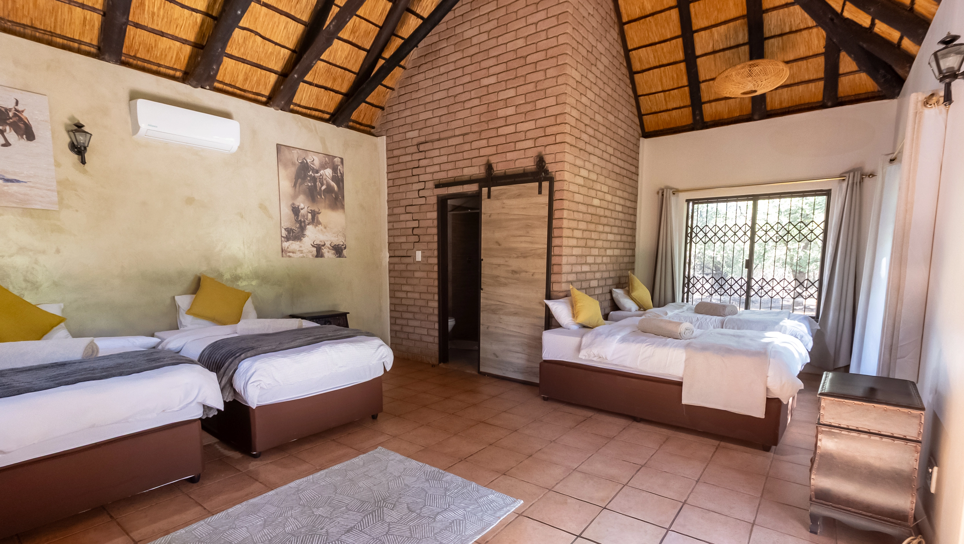 Photo of the exterior of our accommodation, showing a cozy lodge surrounded by African wilderness.