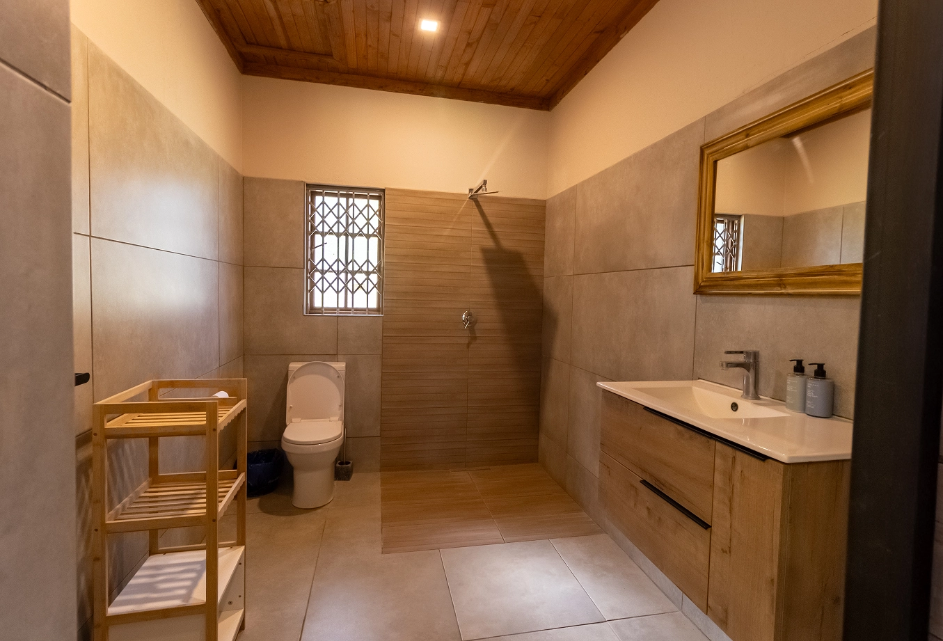 Photo of two single beds with an en-suite bathroom in our accommodation.