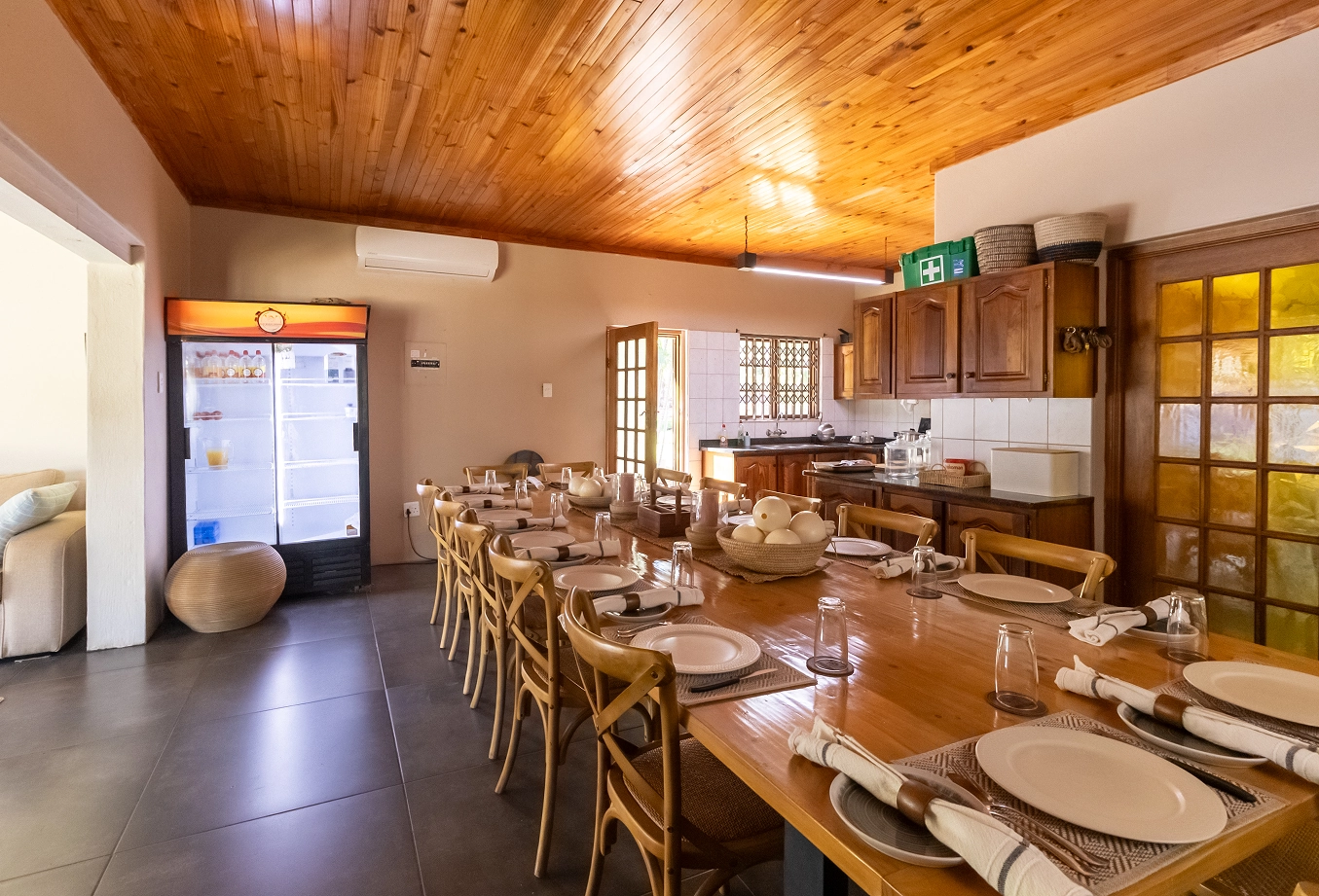 Photo of the dining room of our accommodation, showing a spacious area with elegant table settings.